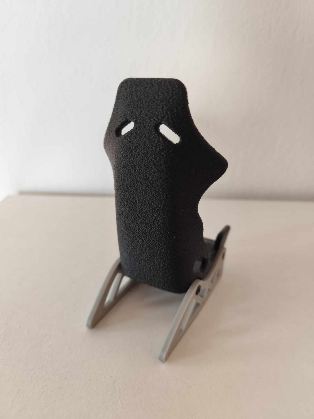 Racing seat phone stand