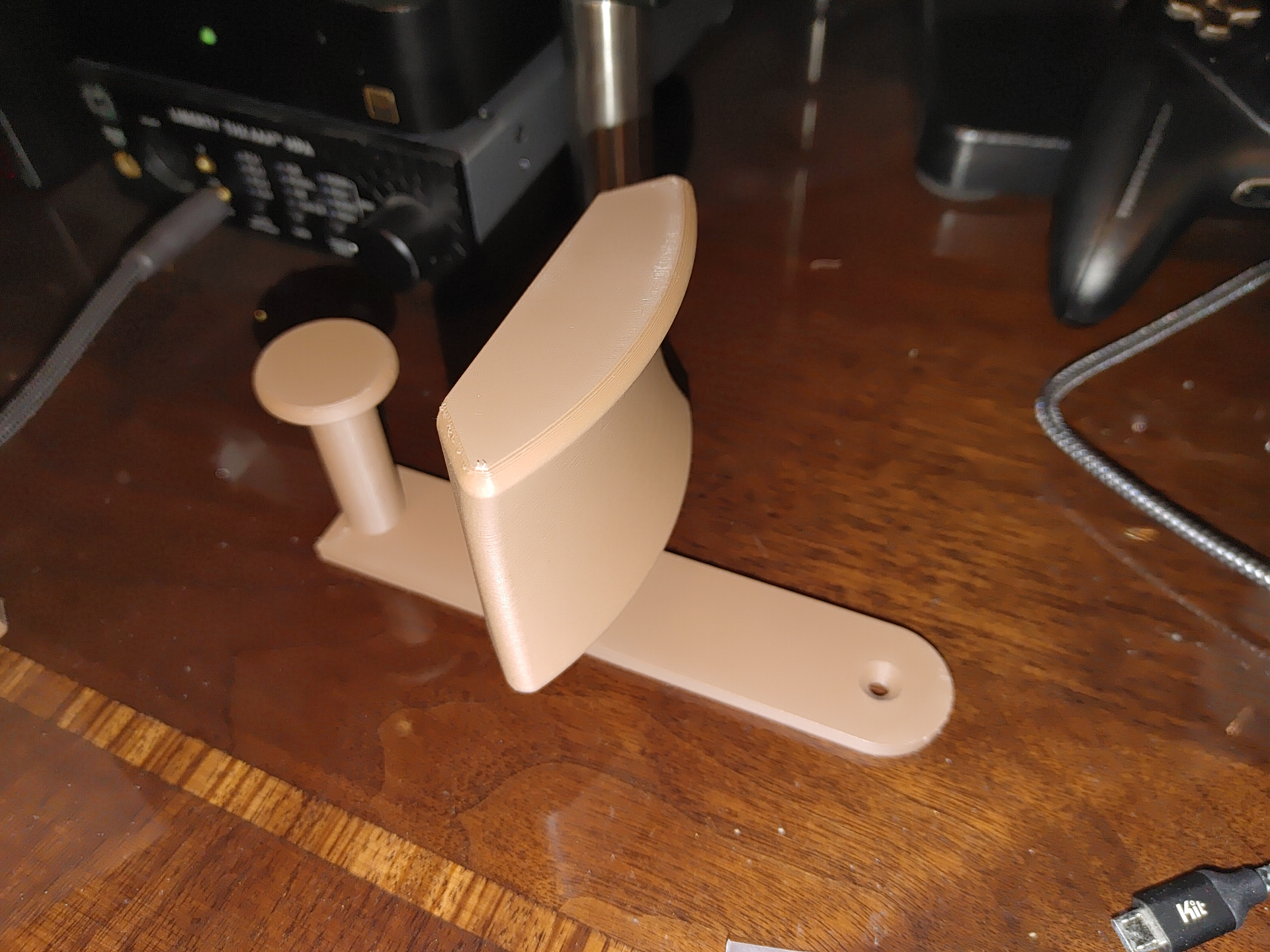 Wall mountable headphone hanger with cable management