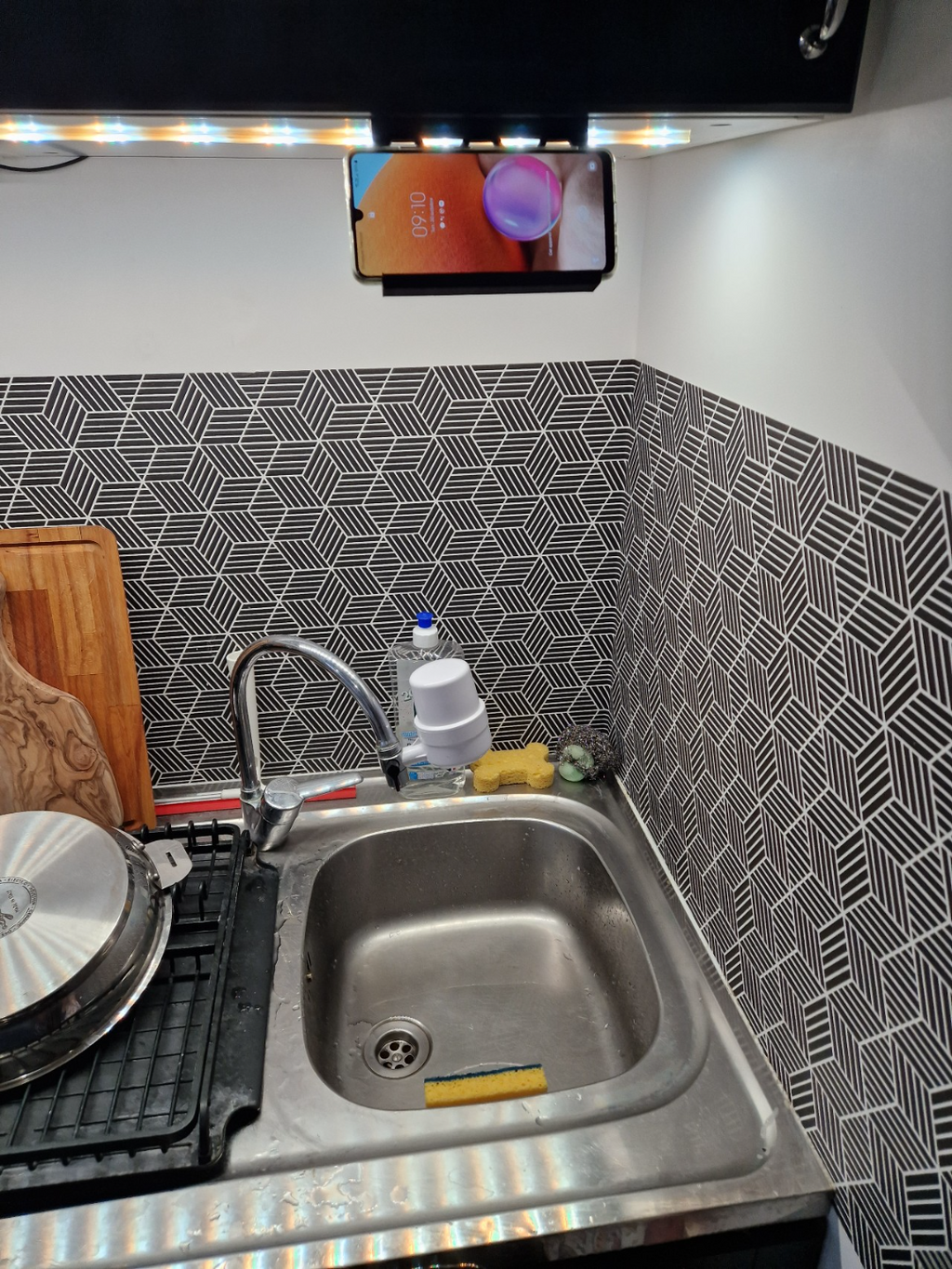 Under cabinet phone stand