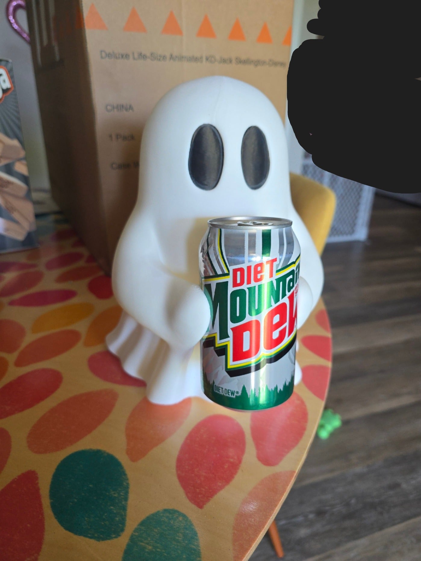 Ghosty holding soda can