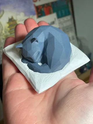 Cute low poly sleeping cat on pillow