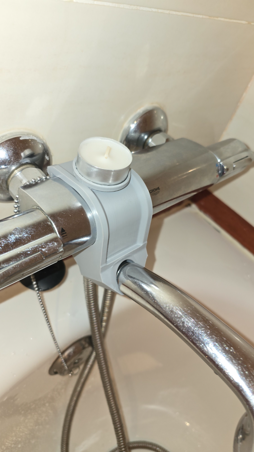 Shower head bracket and tea candle holder