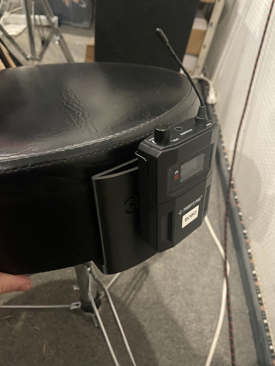 In ear holder for drum throne
