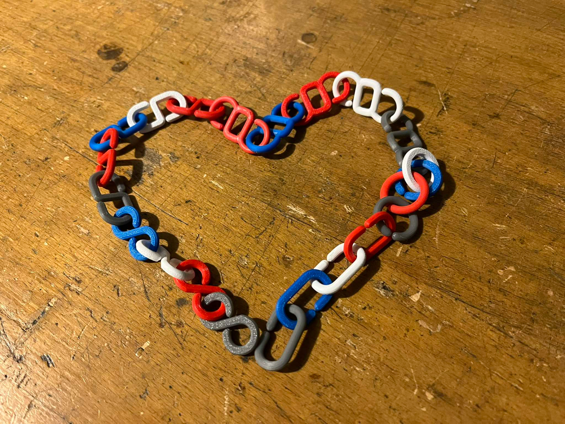 C-shaped, chain links