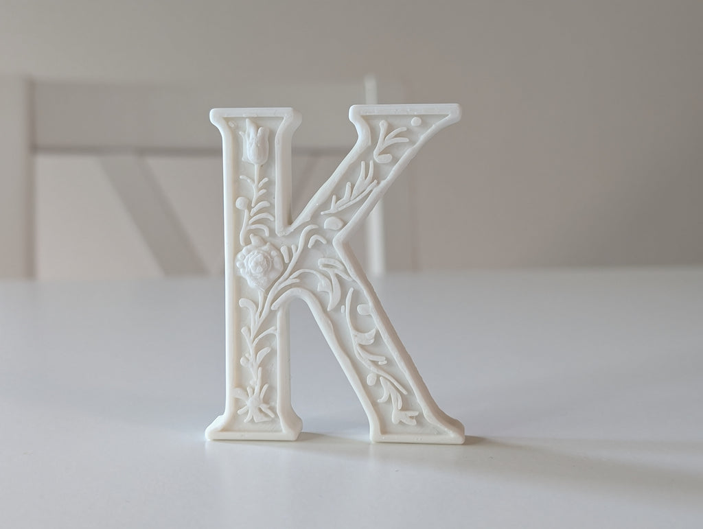 Standing Letter K in a Gypsum Floral Style