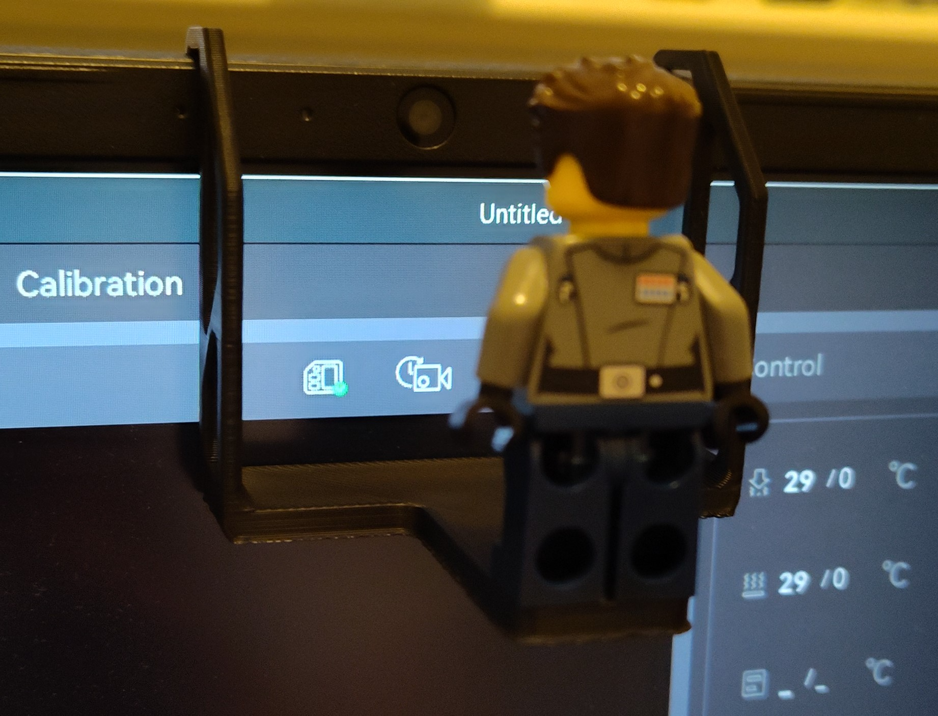 Brick person webcam hanger