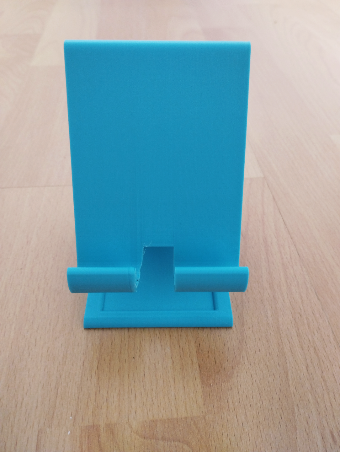 phone holder with charging cable hole