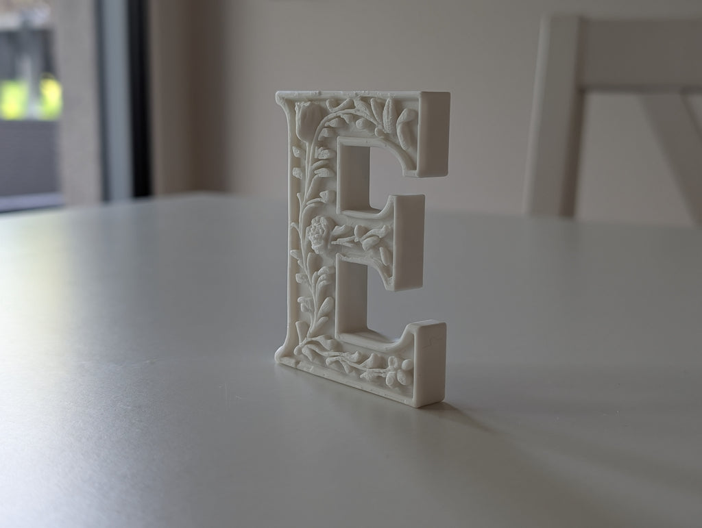 Standing Letter E in a Gypsum Floral Style