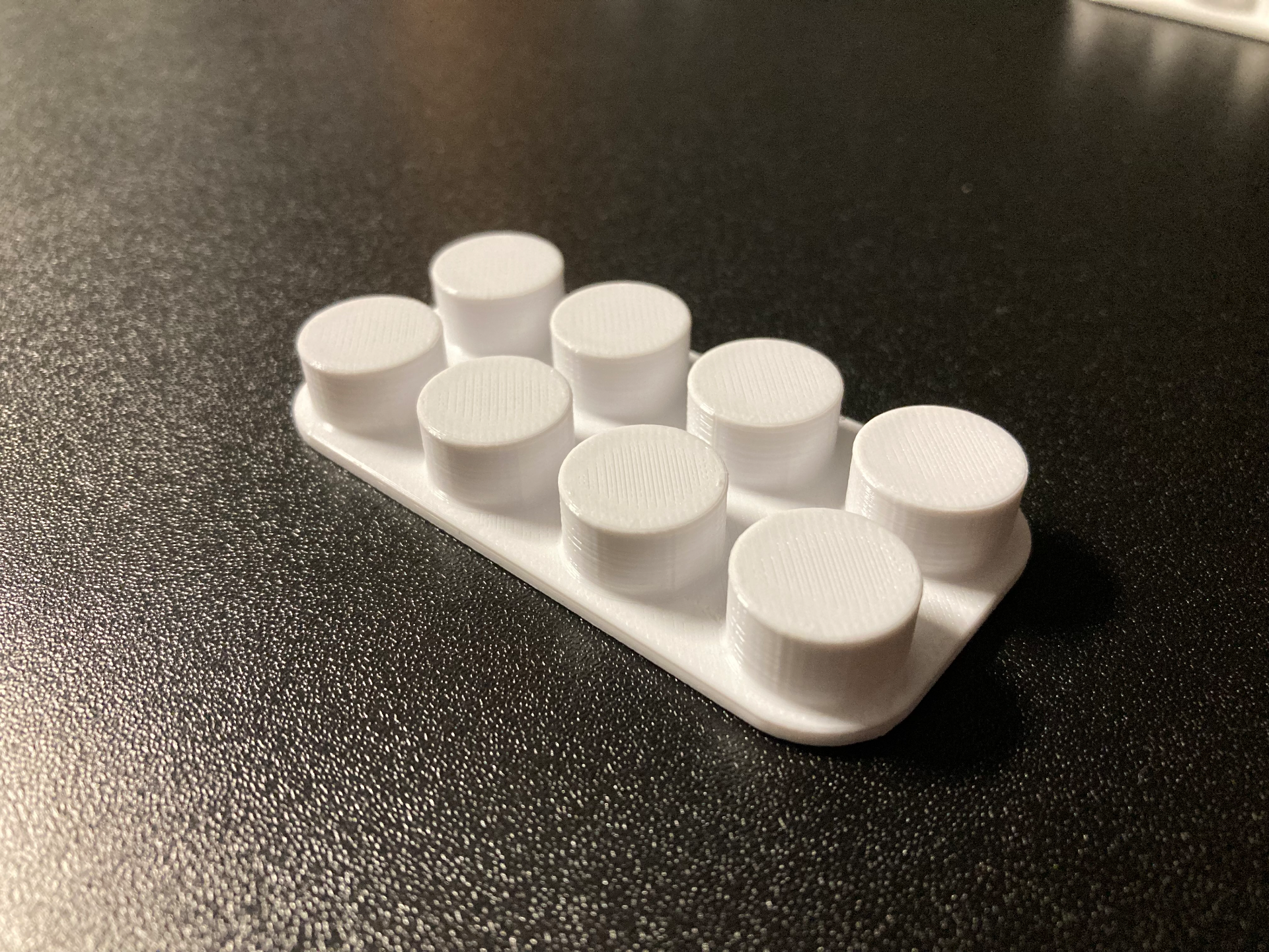 Brick like cable holder
