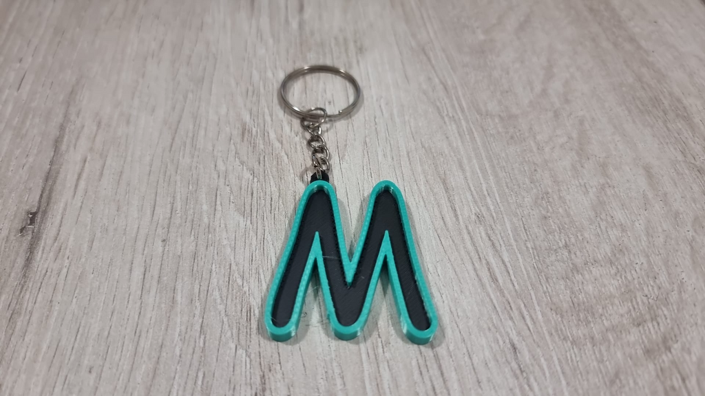 Letters for keychains with raised edge