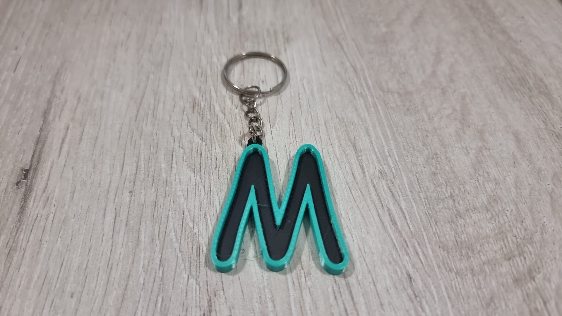 Letters for keychains with raised edge