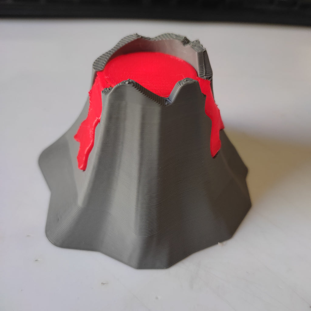 Erupting volcano diorama with glowing lava