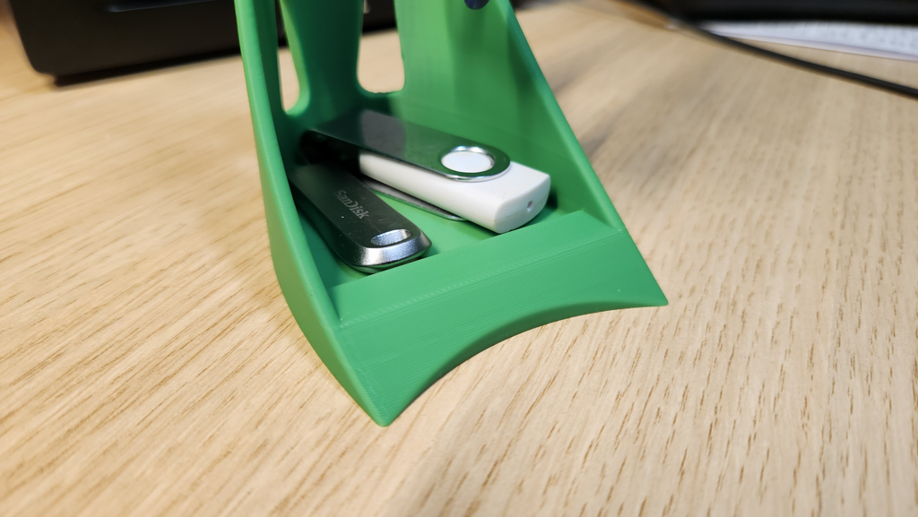 Glasses holder/stand with small storage at bottom.