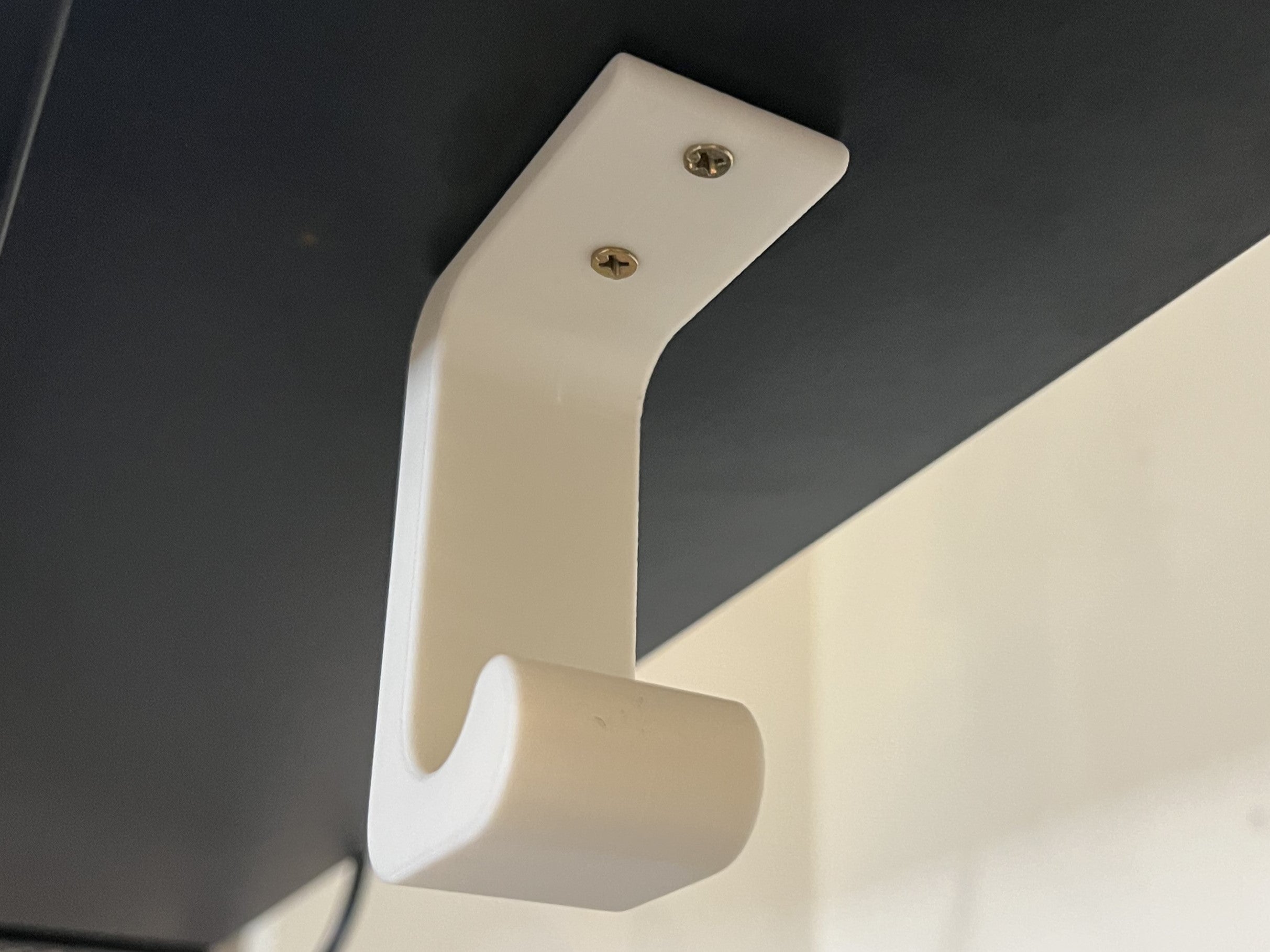 Under-desk headphone holder