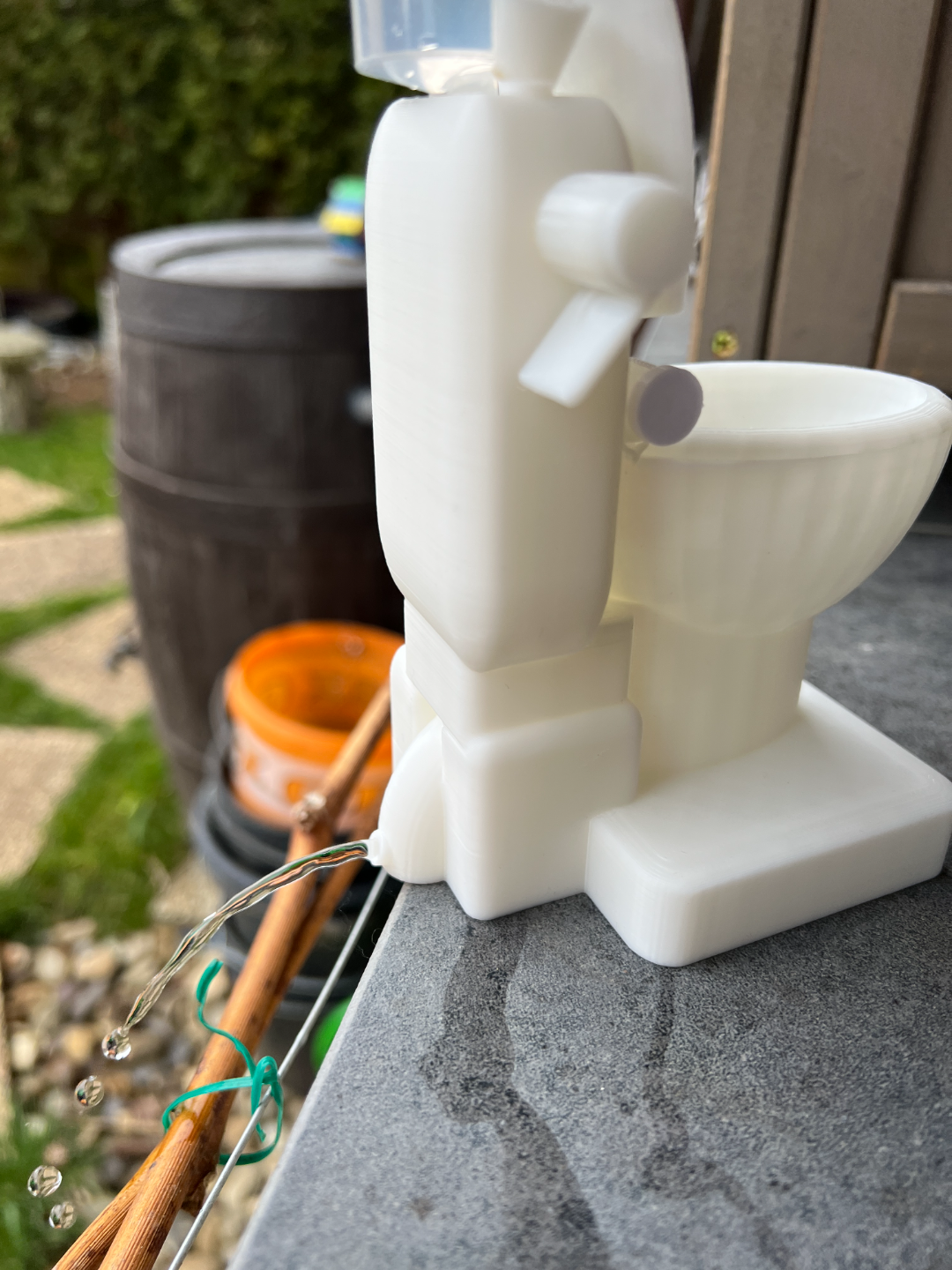 Flushable Toilet Kit - Spits water out the back.