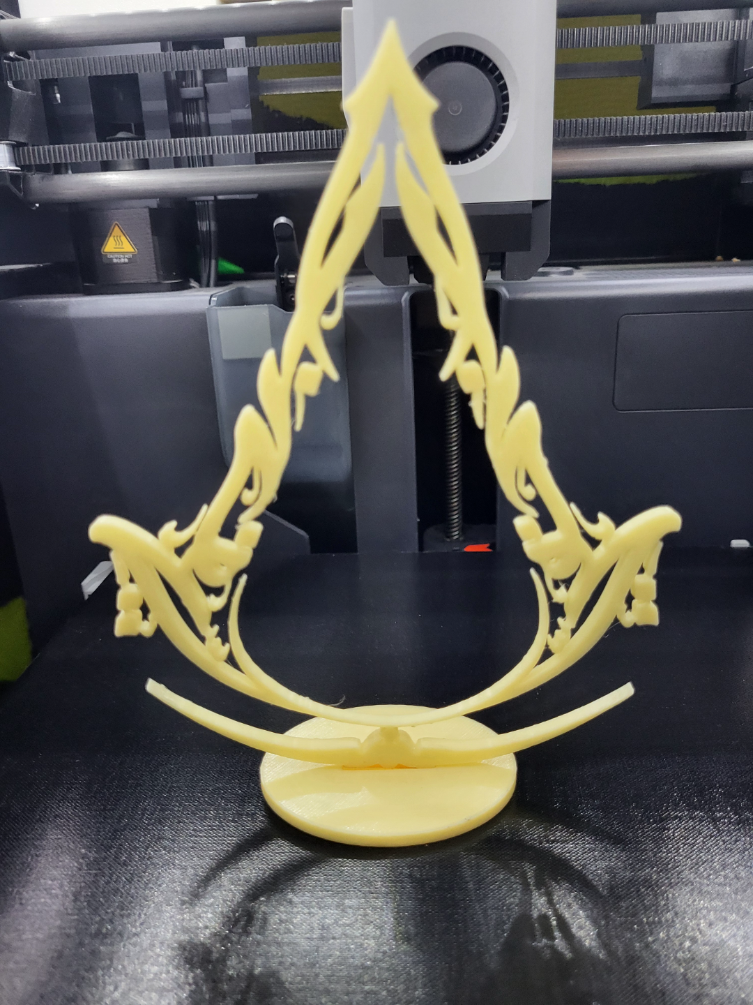assassin's creed mirage logo and stand