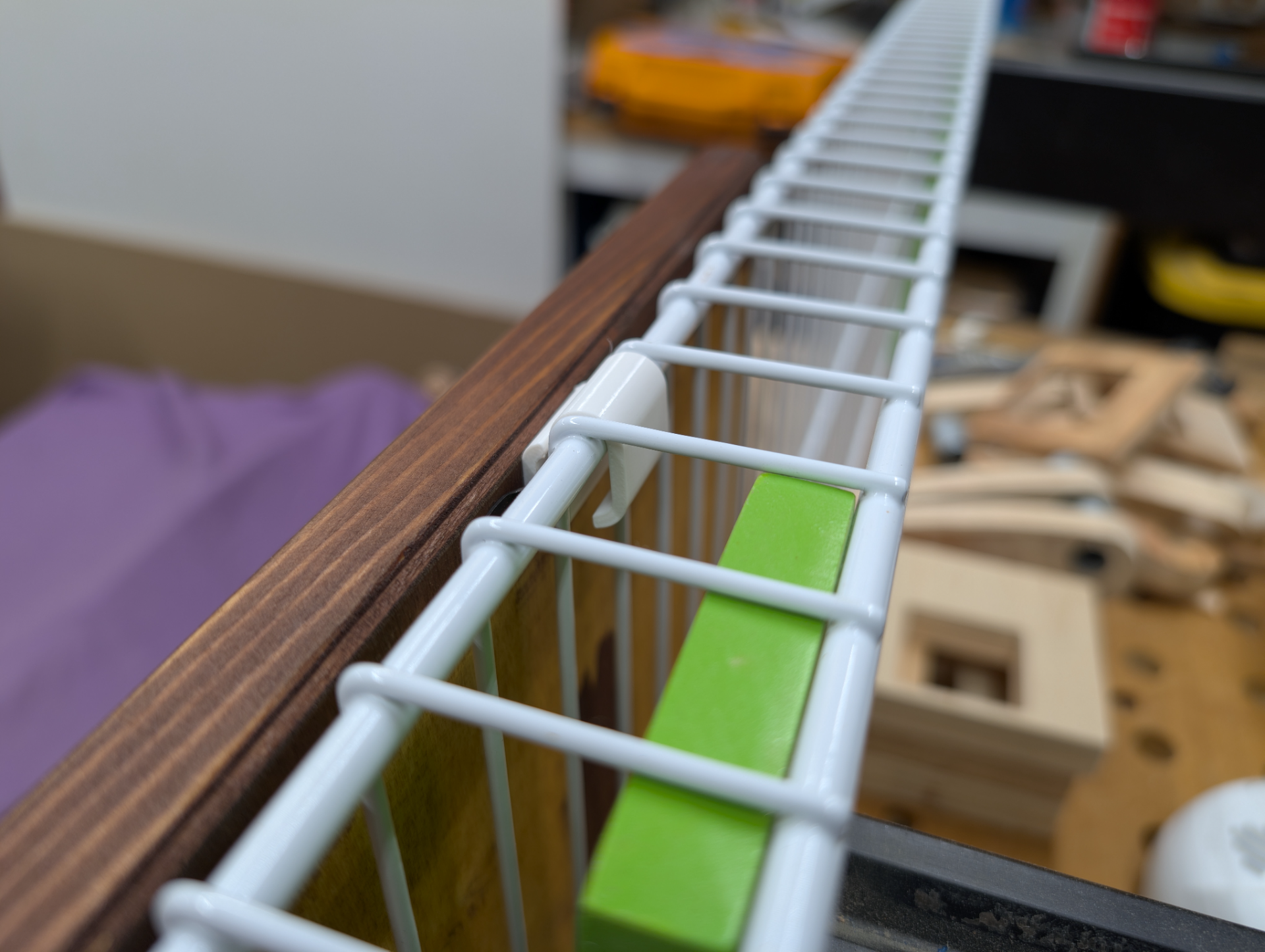 Hook for attaching frames to grid wall