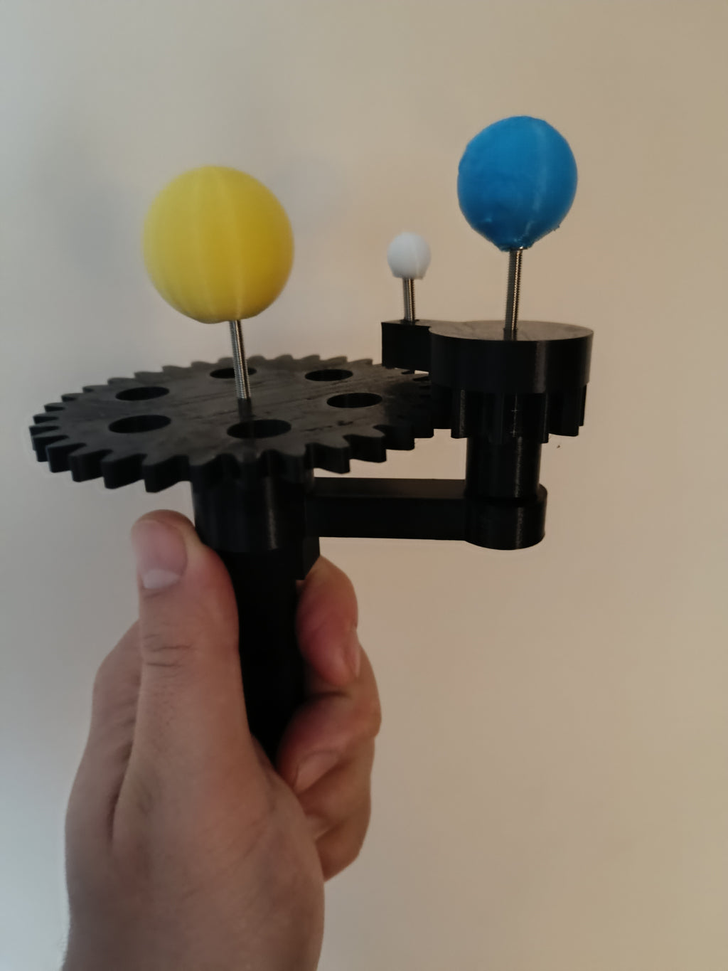 Handheld model of Sun Earth and Moon
