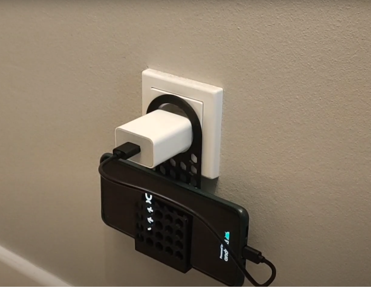Holder for charging mobile phone for the socket.