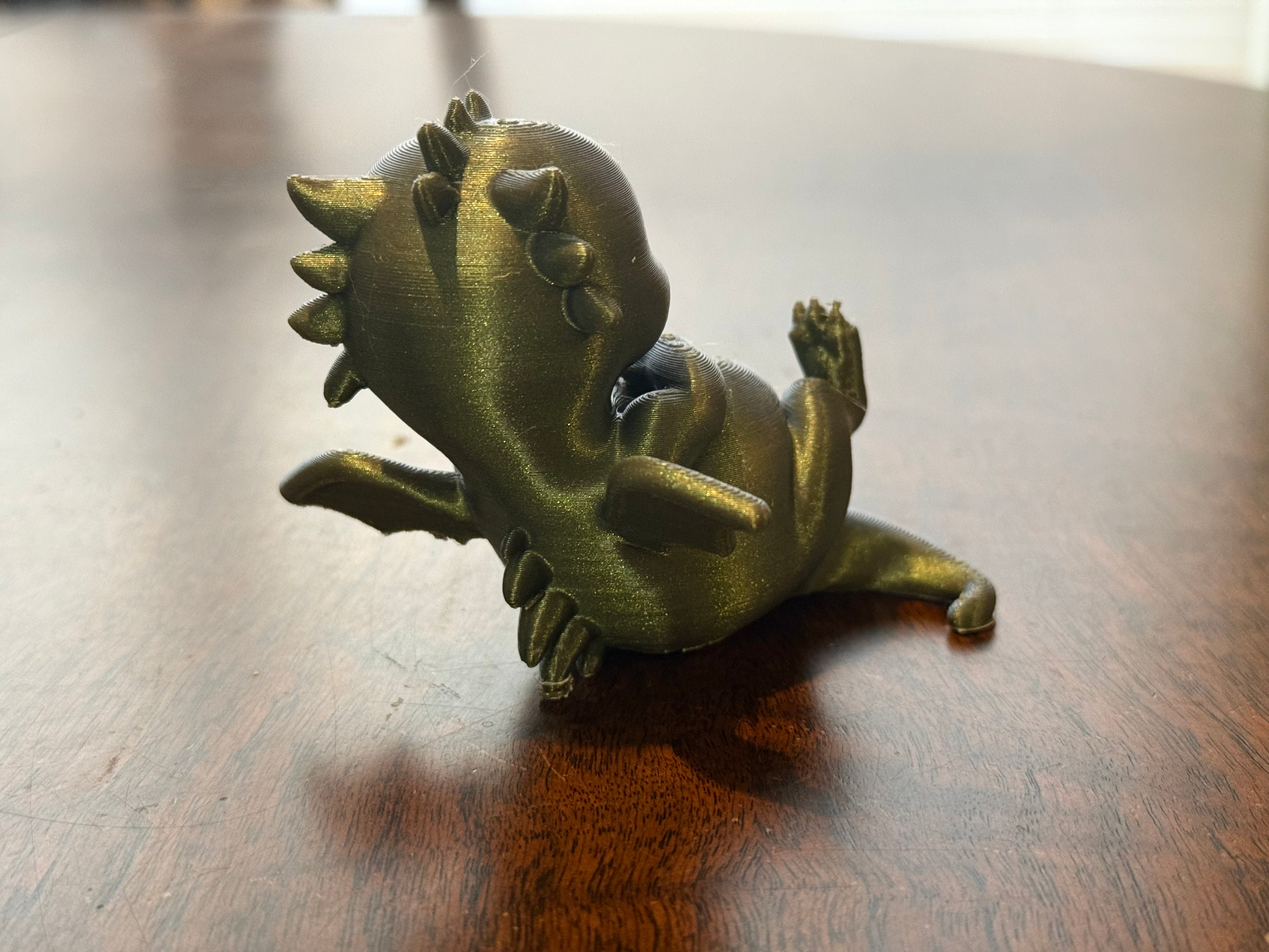 Adorable lounging baby dragon