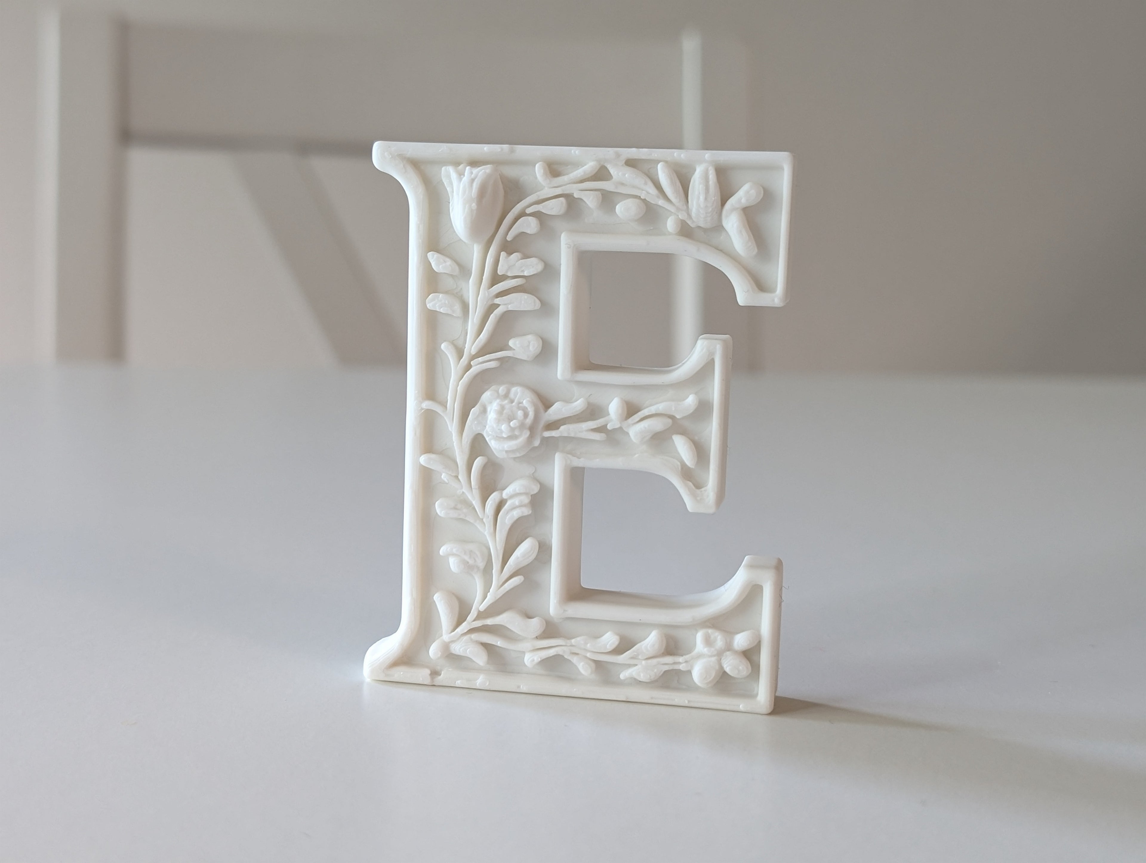 Standing Letter E in a Gypsum Floral Style