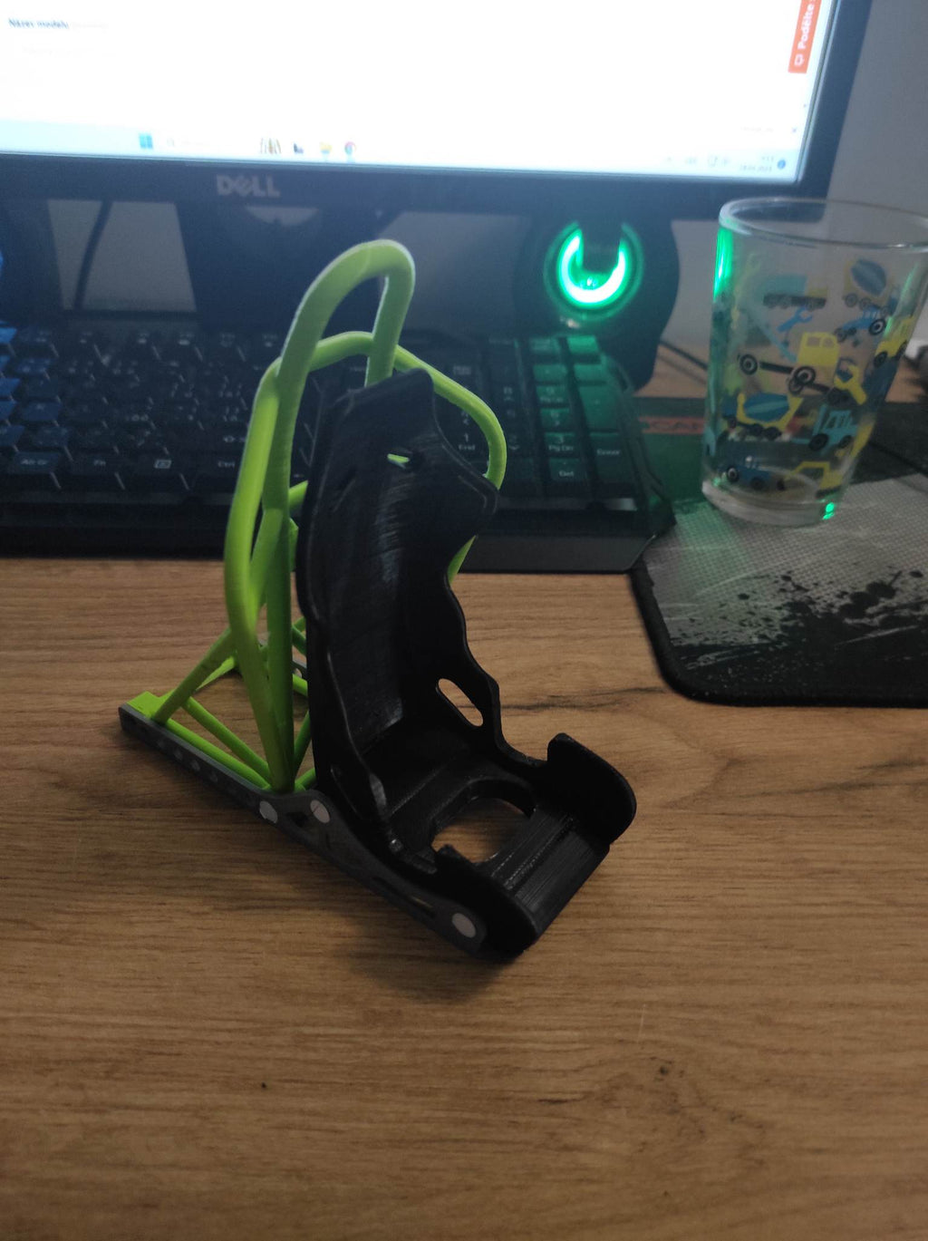 Racing seat phone stand with roll cage