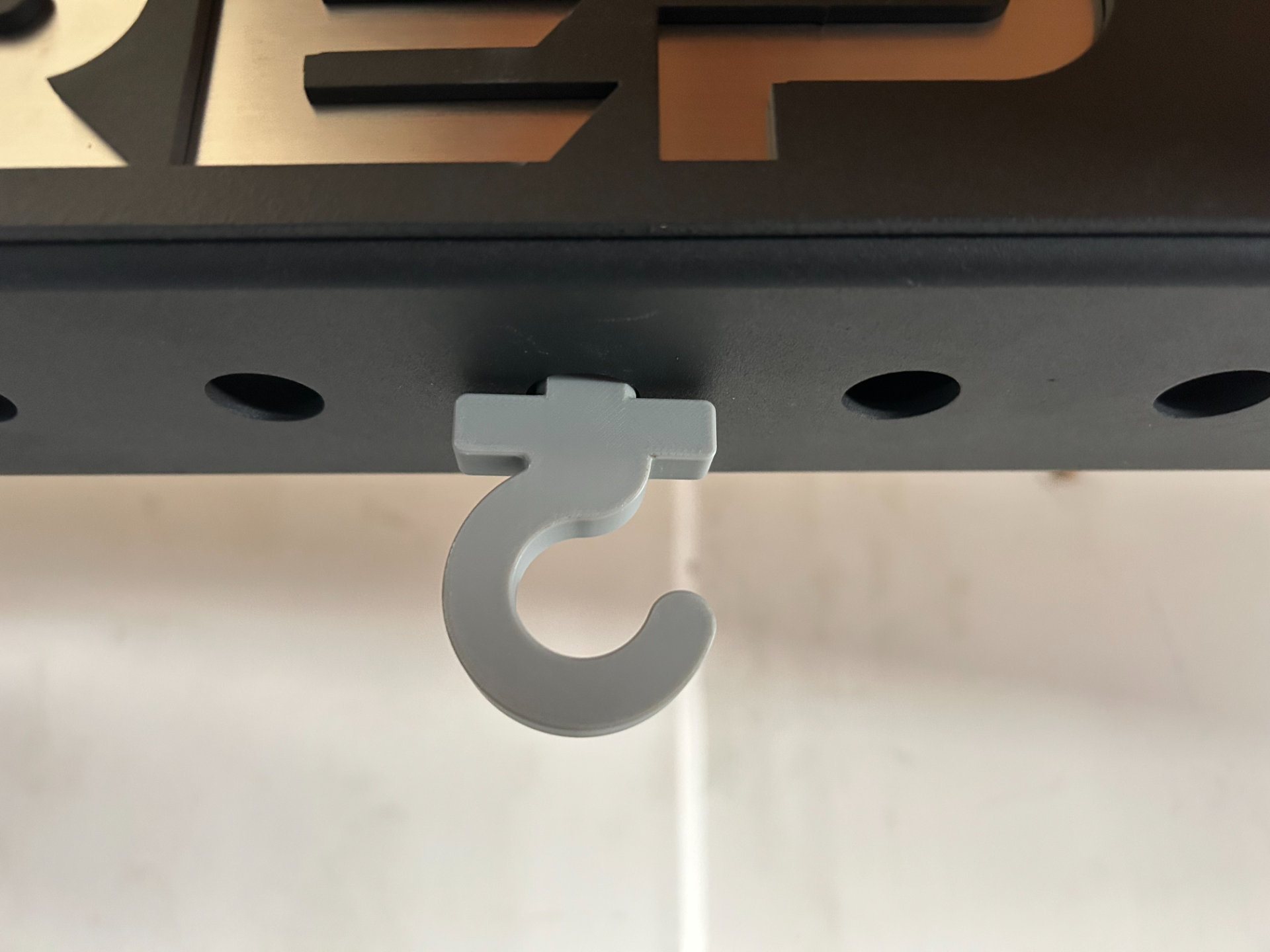 Bolt on 3/8 power rack or multi use utility hook.