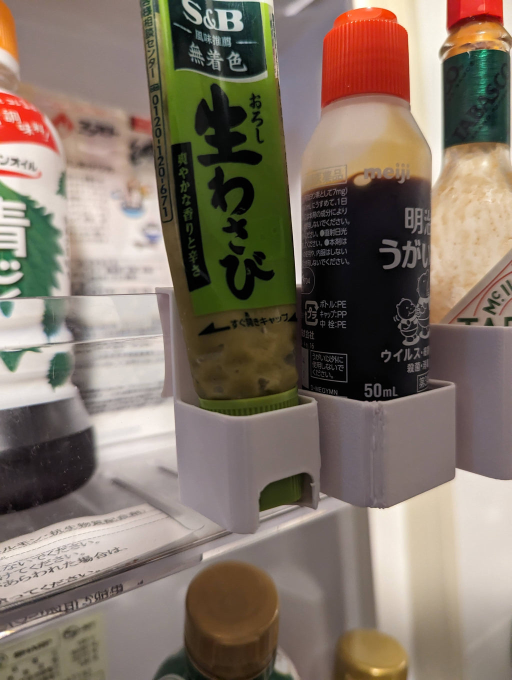 Fridge door hanging organizer for small bottles and pastes