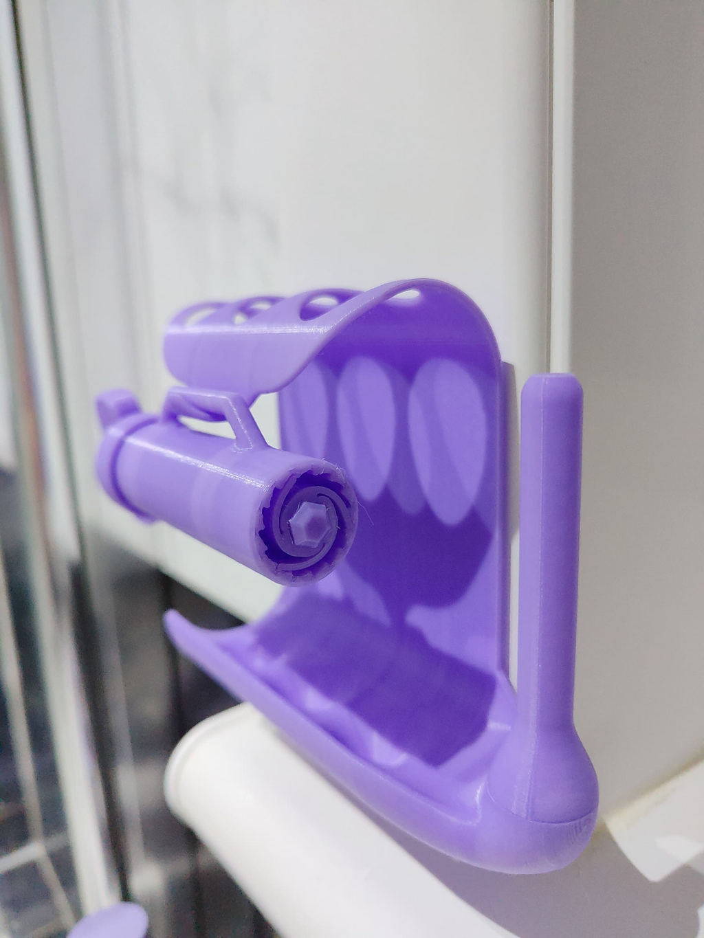 Toothpaste squeezer and toothbrush holder