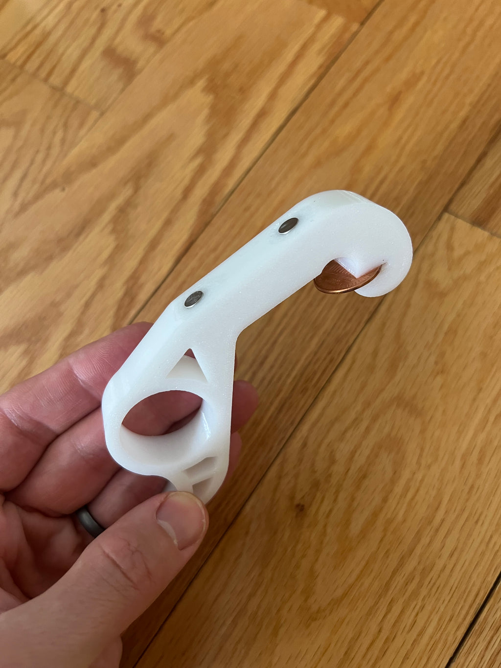 The Penny Popper: A one handed magnetic bottle opener for your fridge