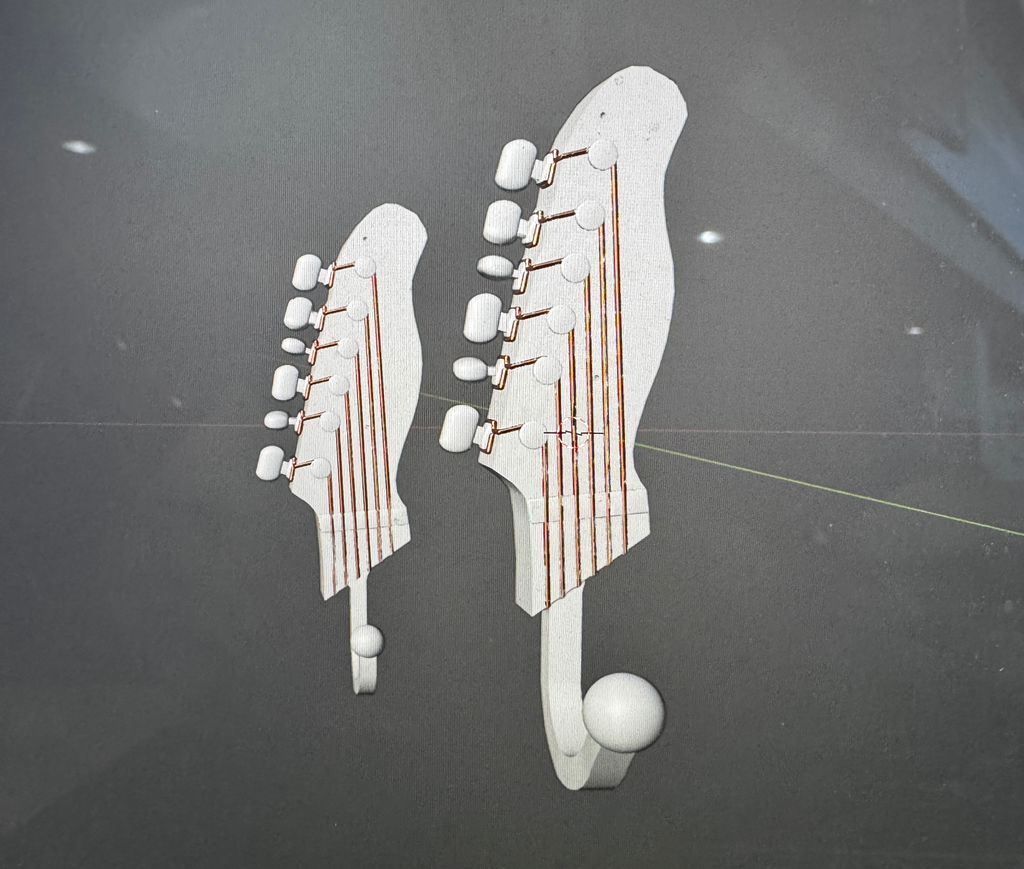 Guitar shaped hanger