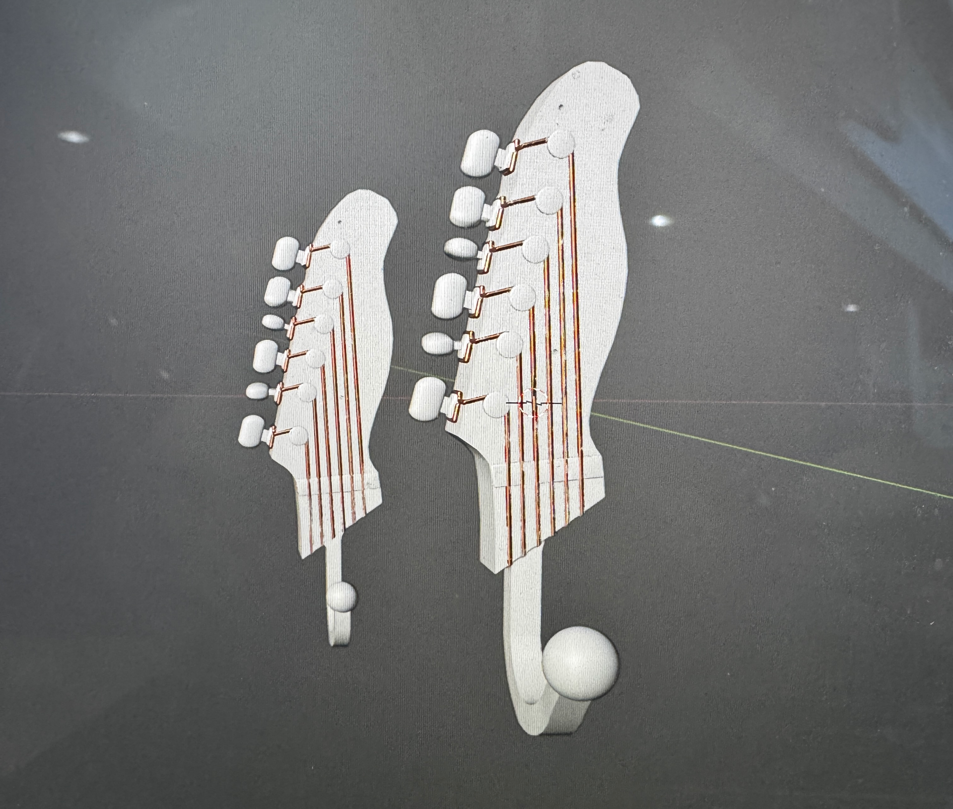 Guitar shaped hanger