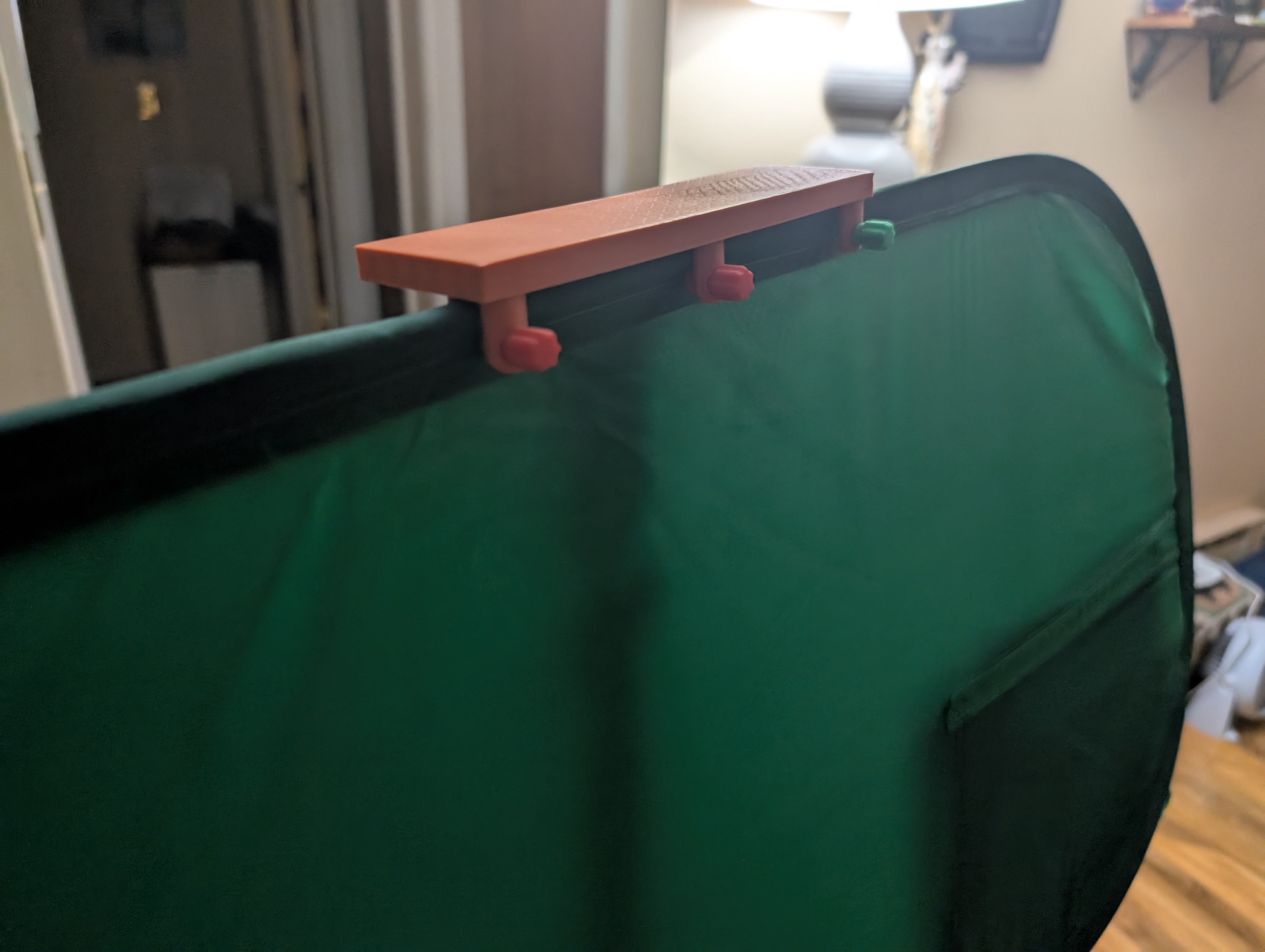 Tripod mounted green screen holder clip