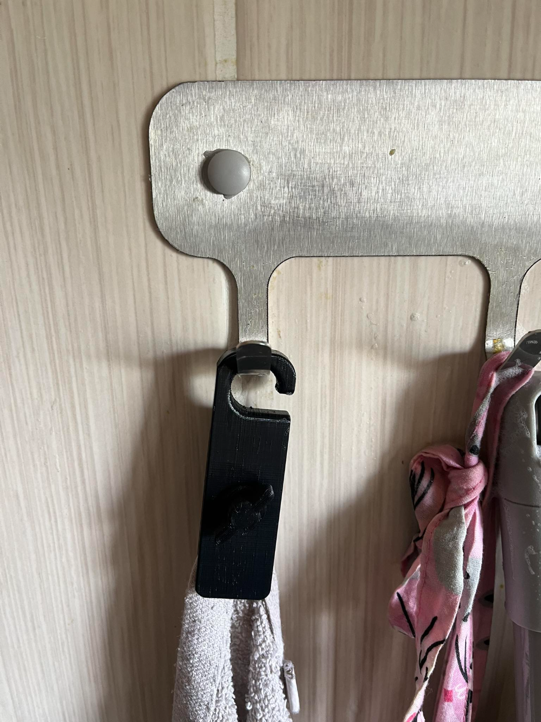 Buckle, holder for a towel, cloth without a handle