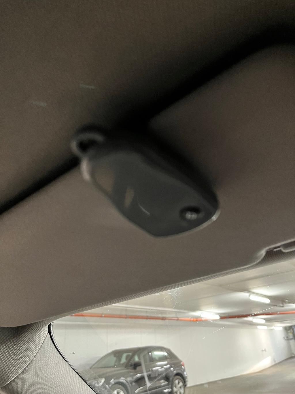 Sun visor clip for any garage remote control