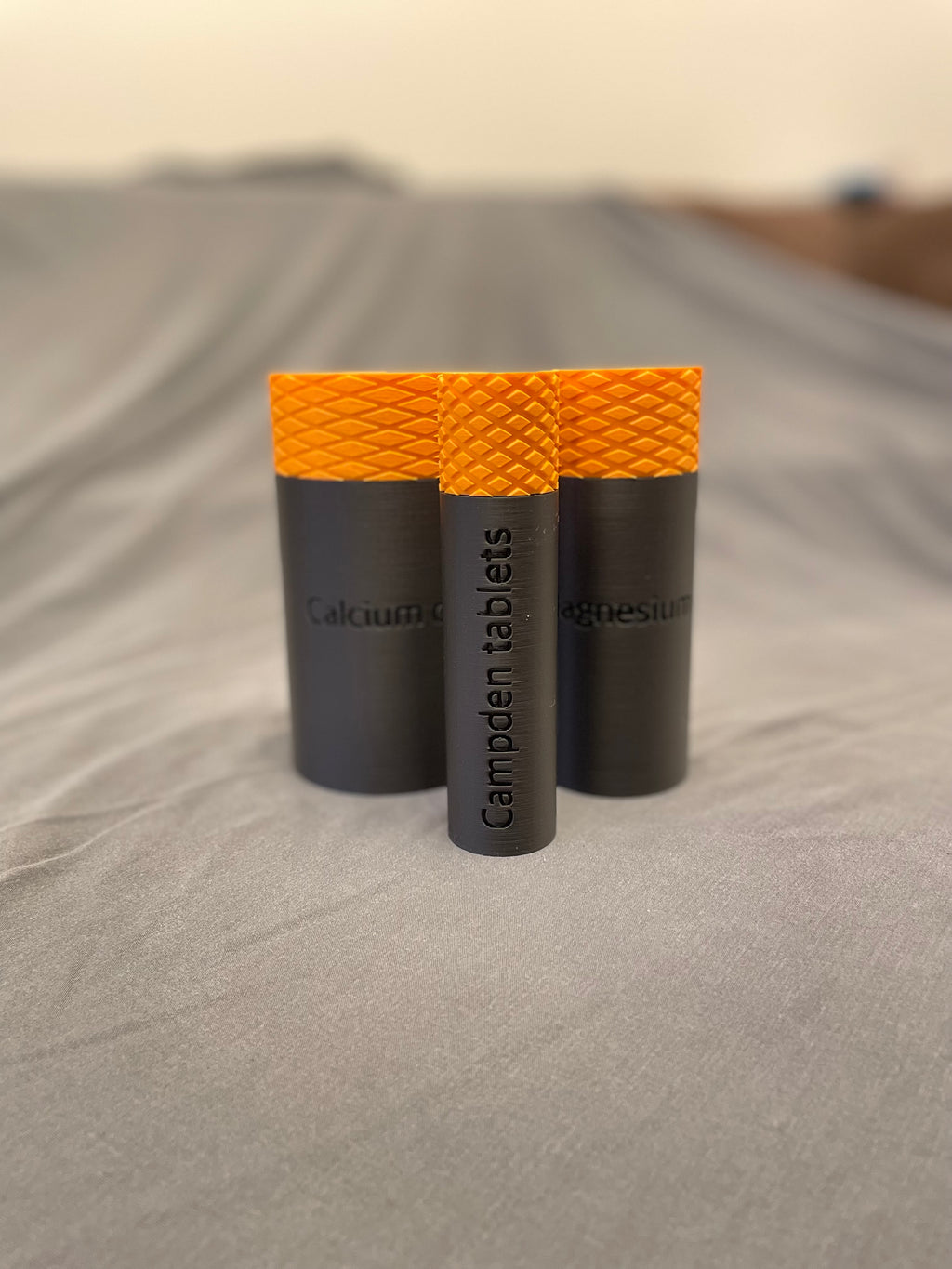 Screw top containers with TPU seal, embossed label