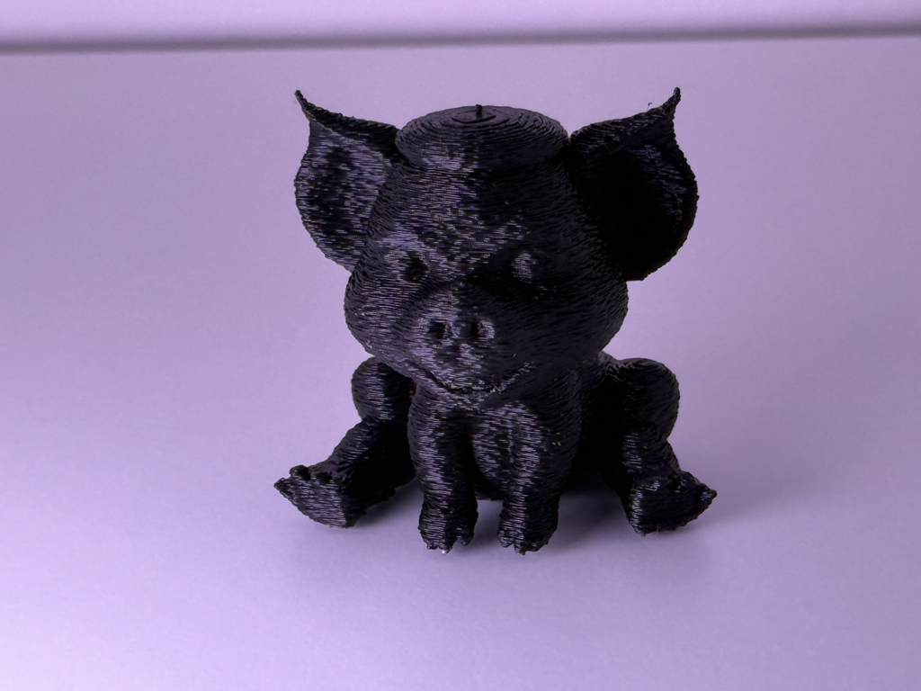 Cute knitted pig with cylinder