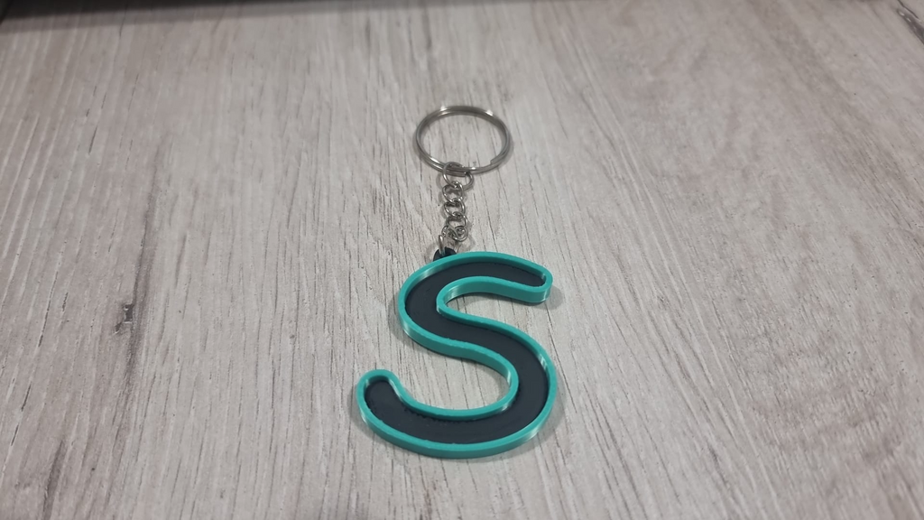 Letters for keychains with raised edge