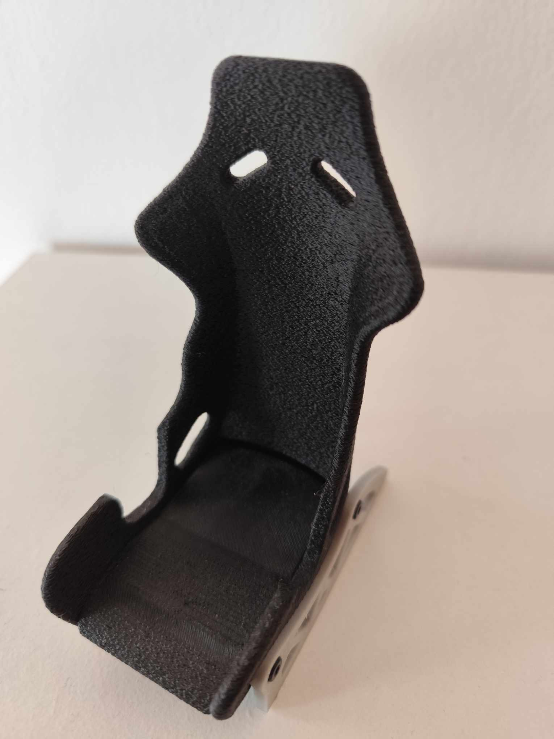 Racing seat phone stand