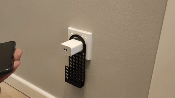 Holder for charging mobile phone for the socket.