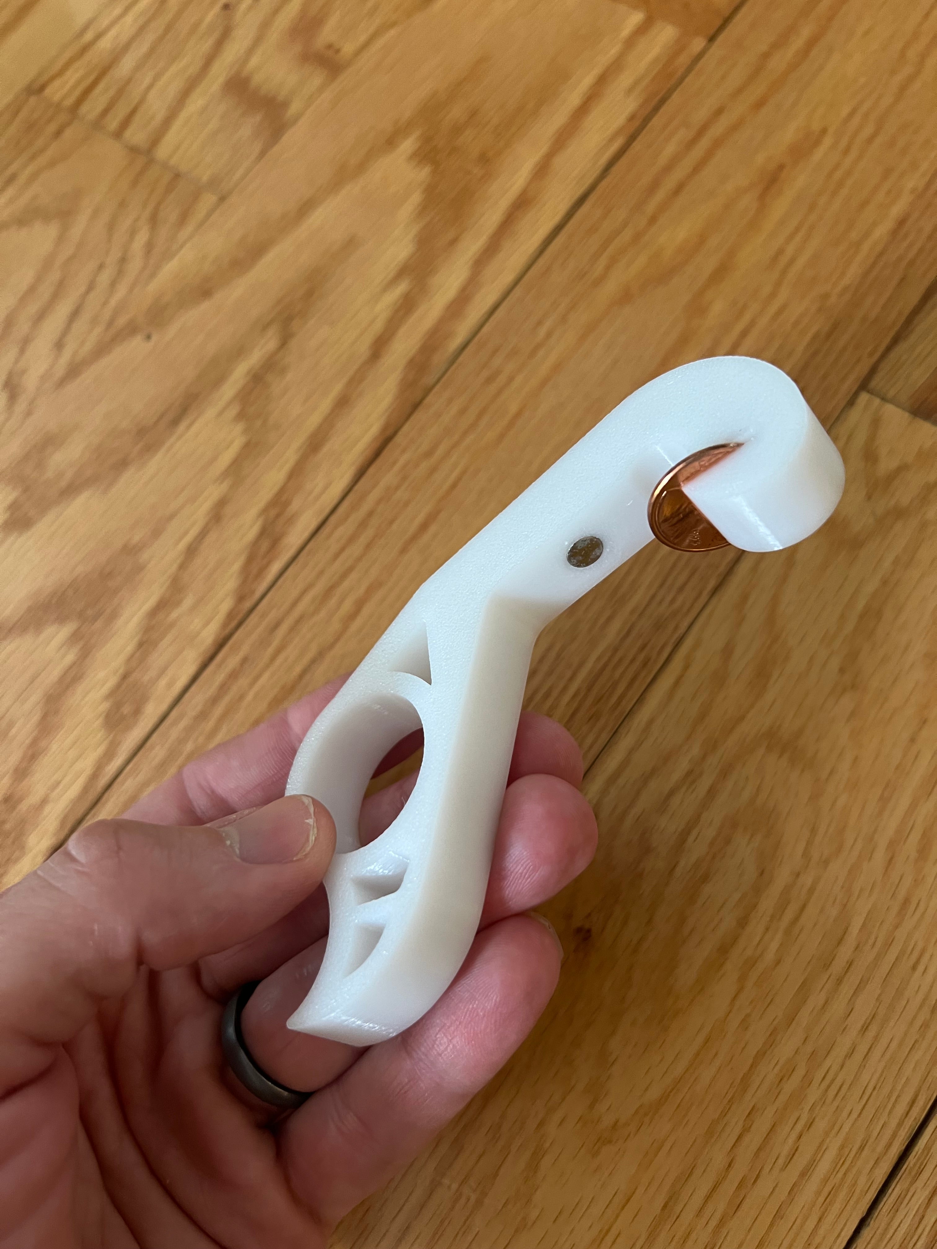 The Penny Popper: A one handed magnetic bottle opener for your fridge
