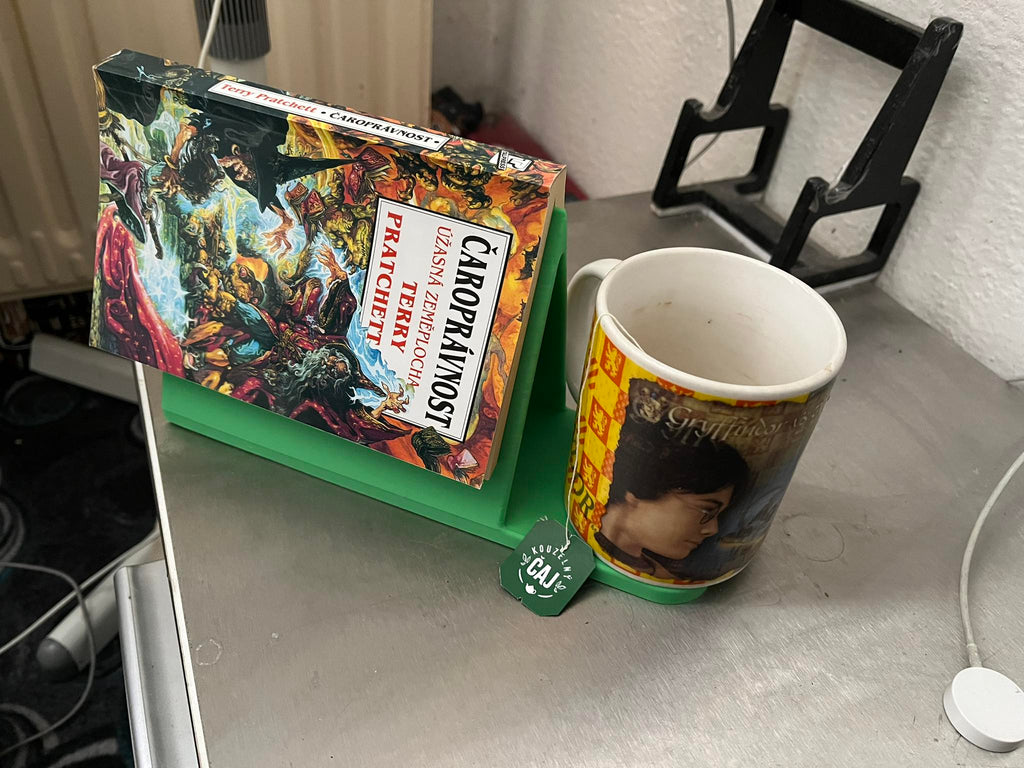 Holder for a read book and a mug of tea