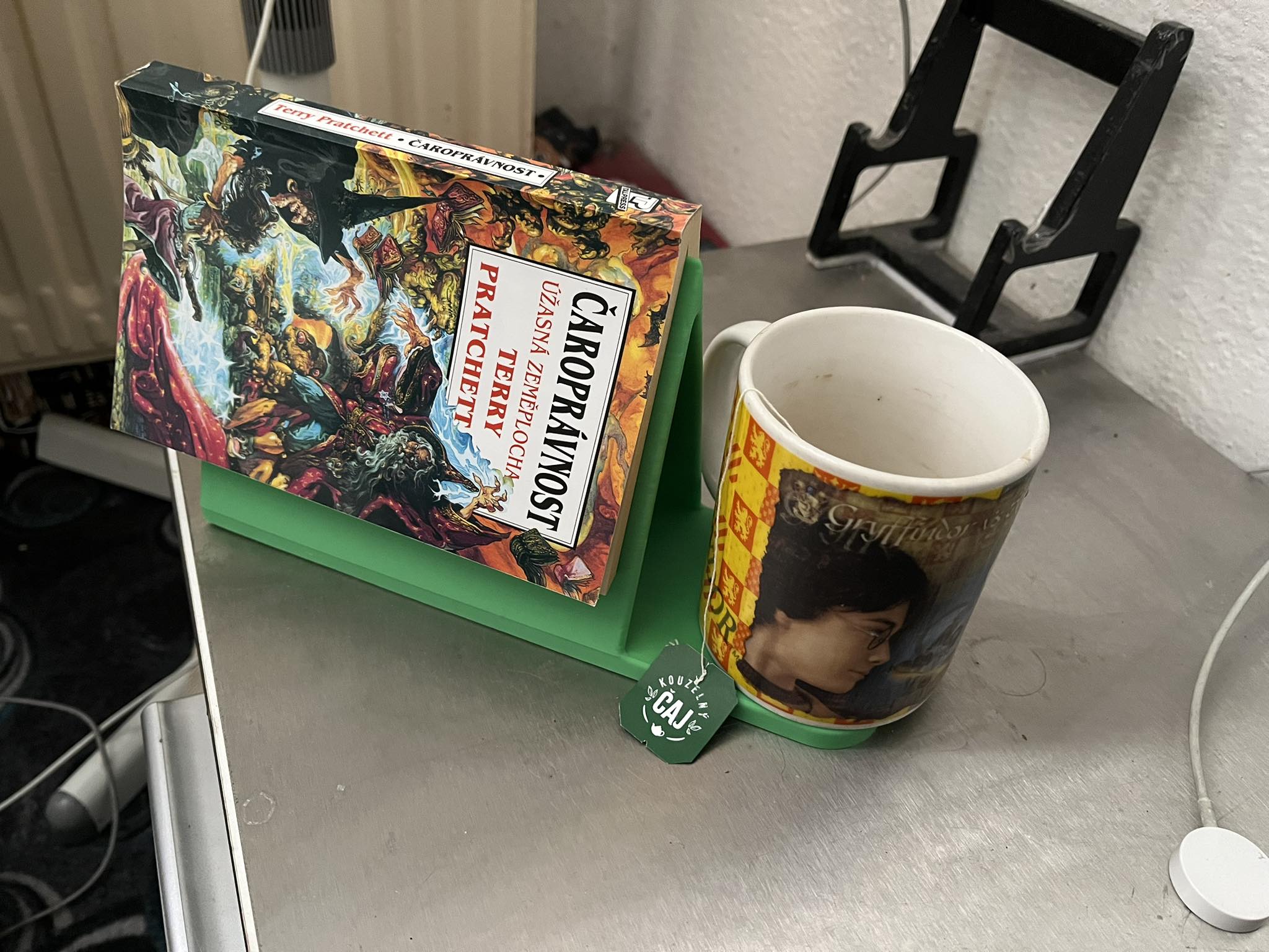 Holder for a read book and a mug of tea