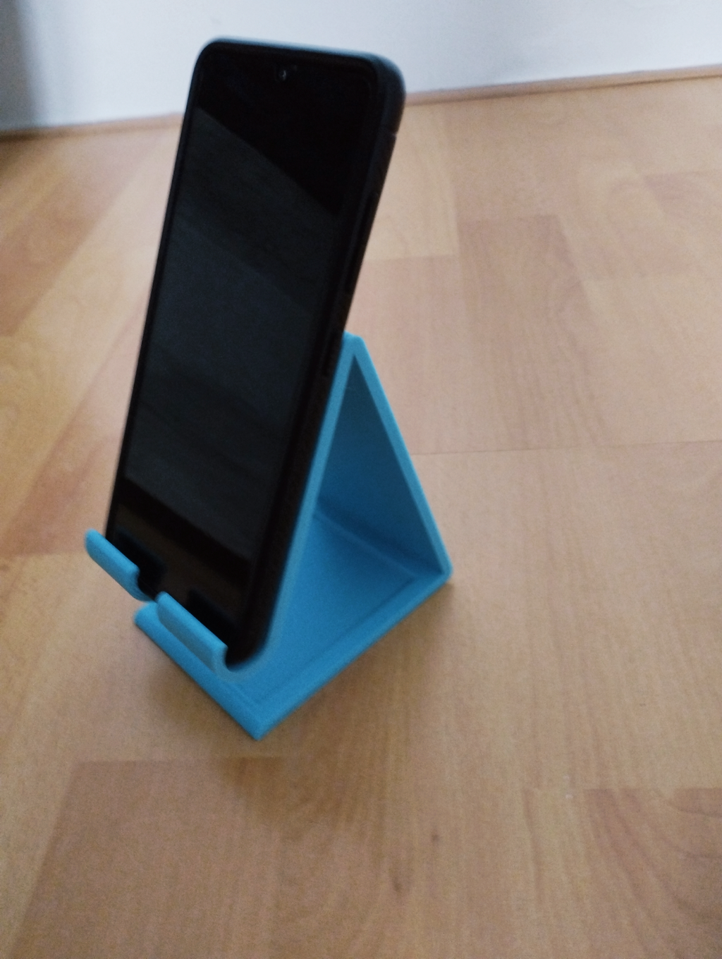 phone holder with charging cable hole