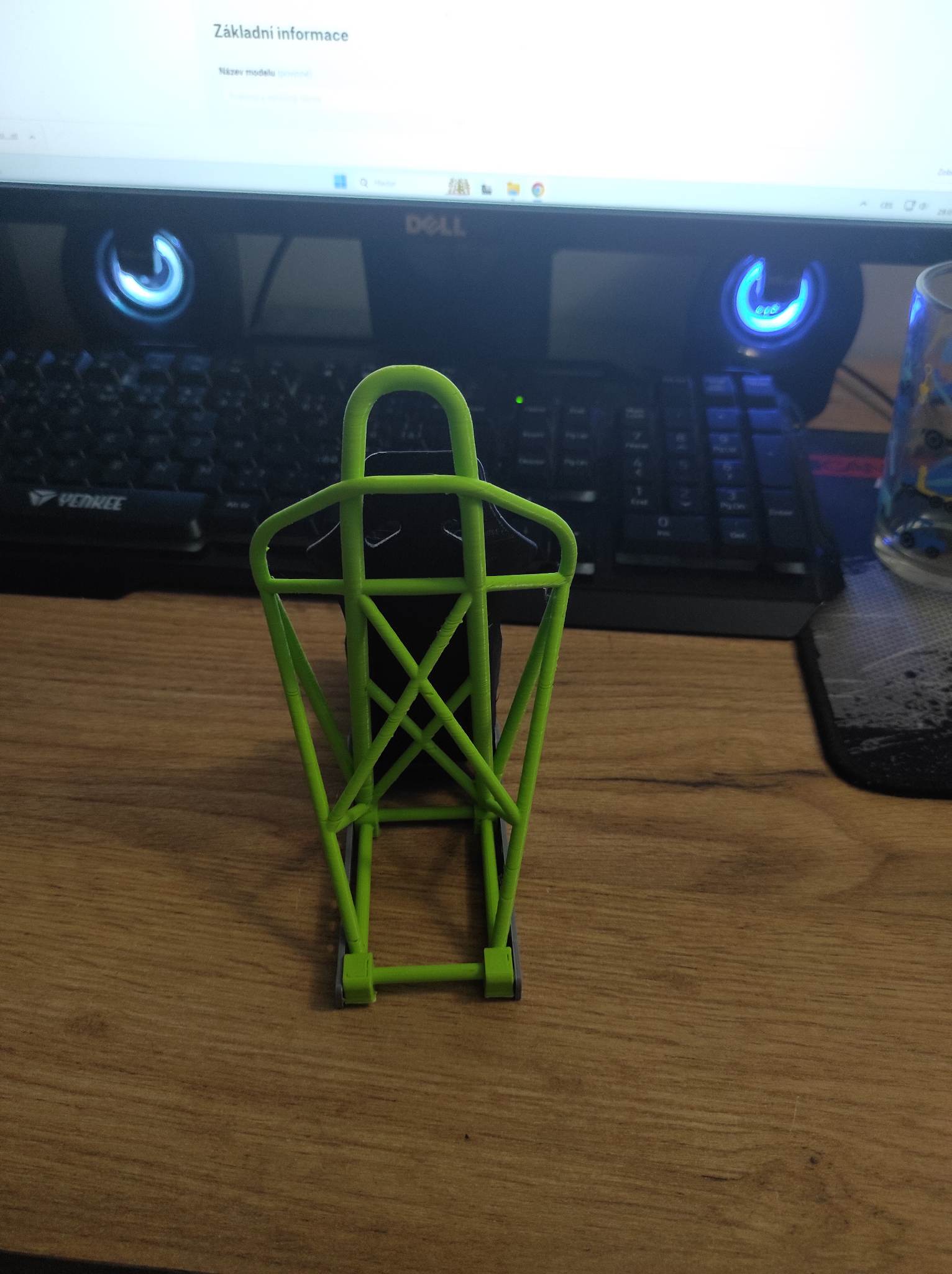 Racing seat phone stand with roll cage
