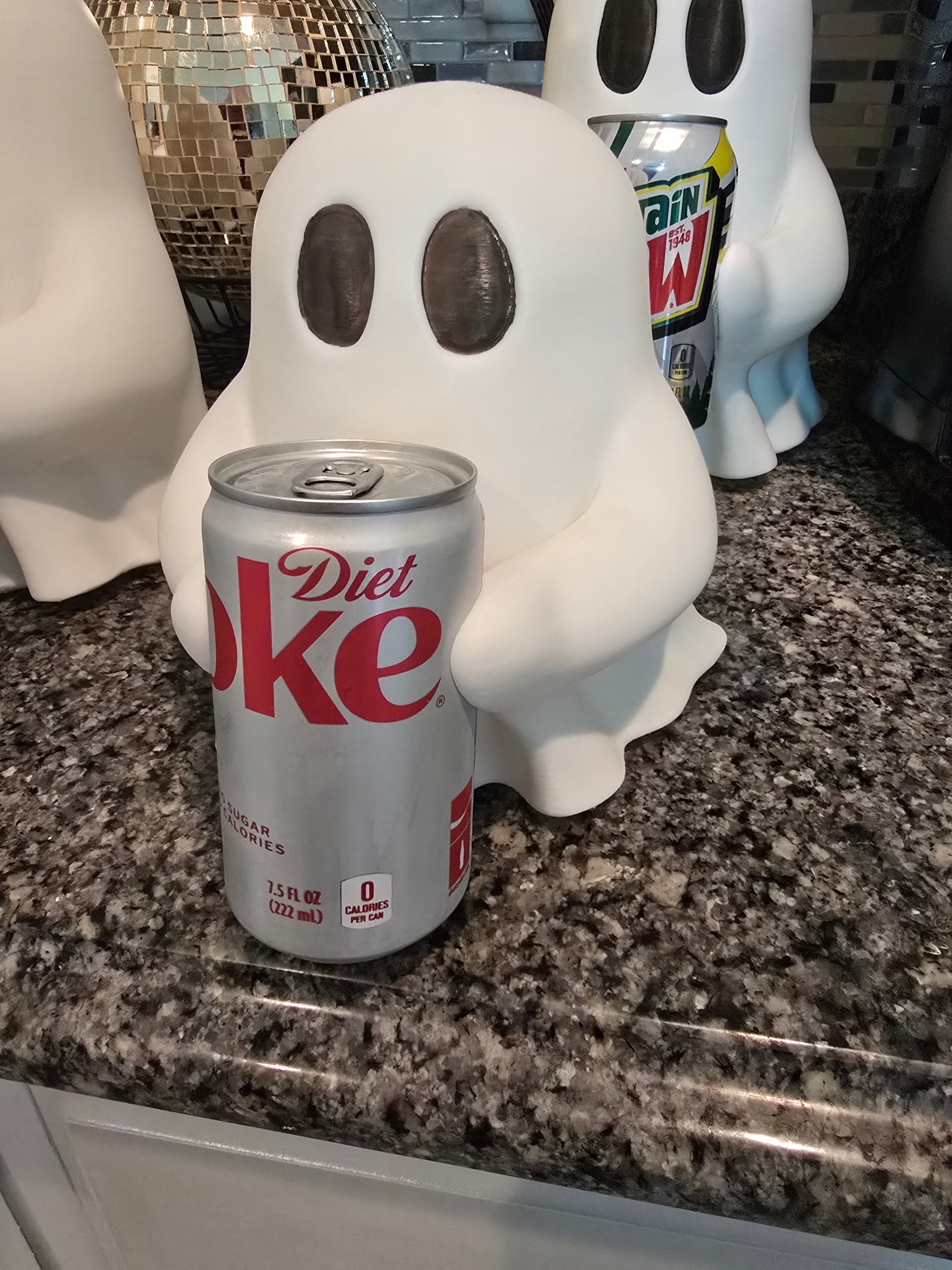 Ghosty holding soda can