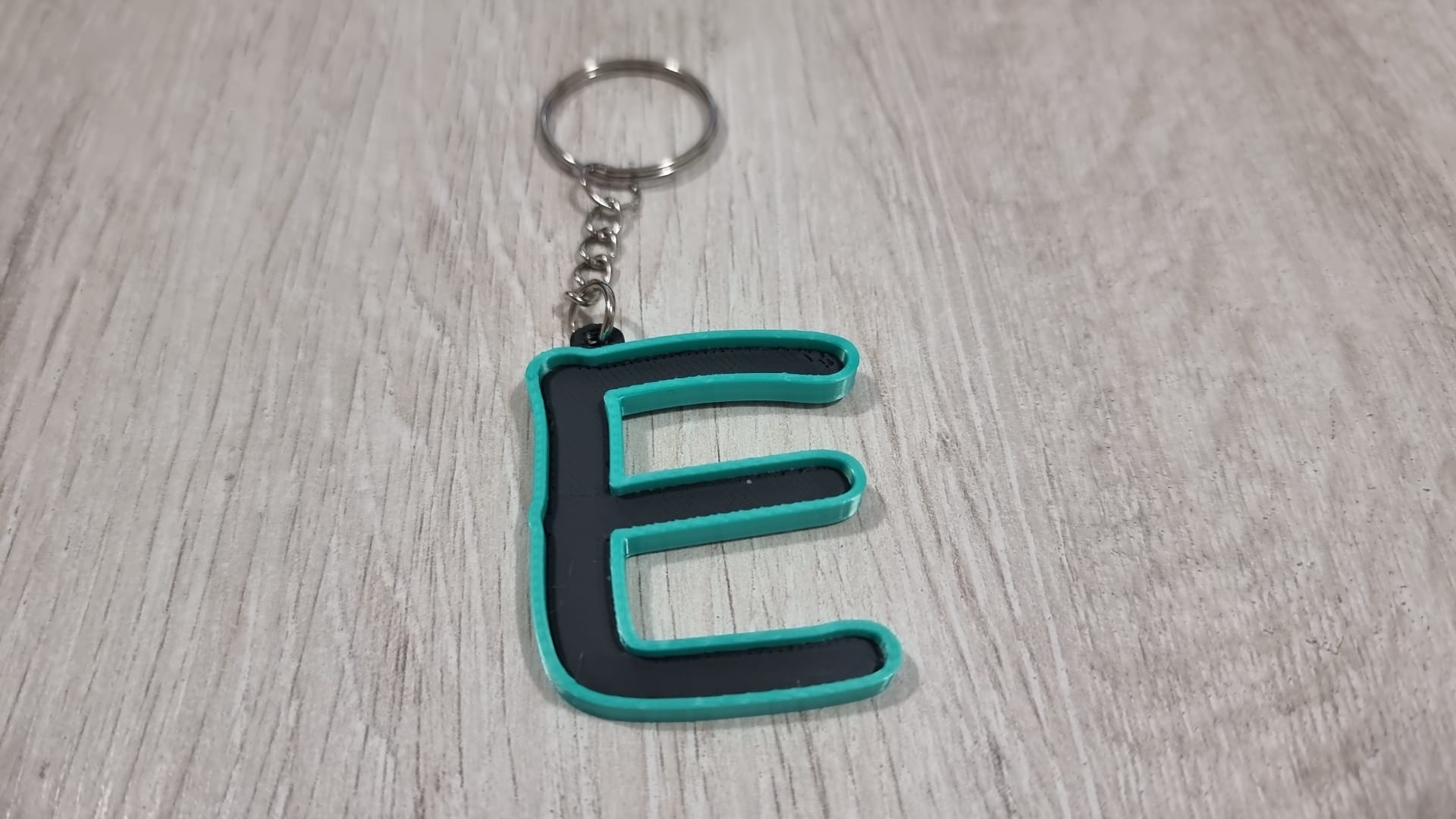 Letters for keychains with raised edge