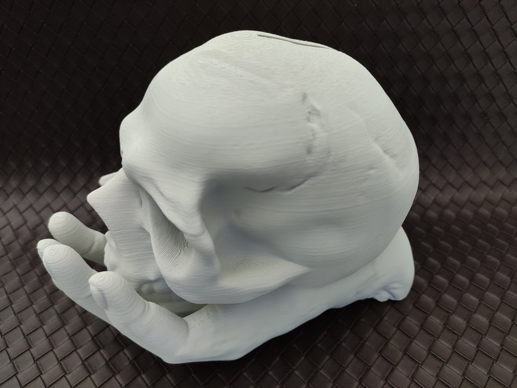 Skull in Hand - Coin bank / Piggy bank