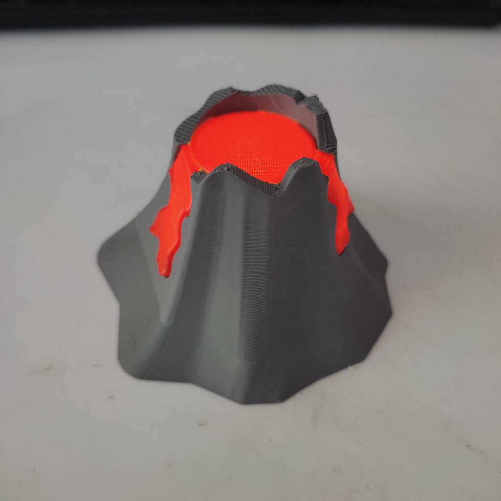 Erupting volcano diorama with glowing lava