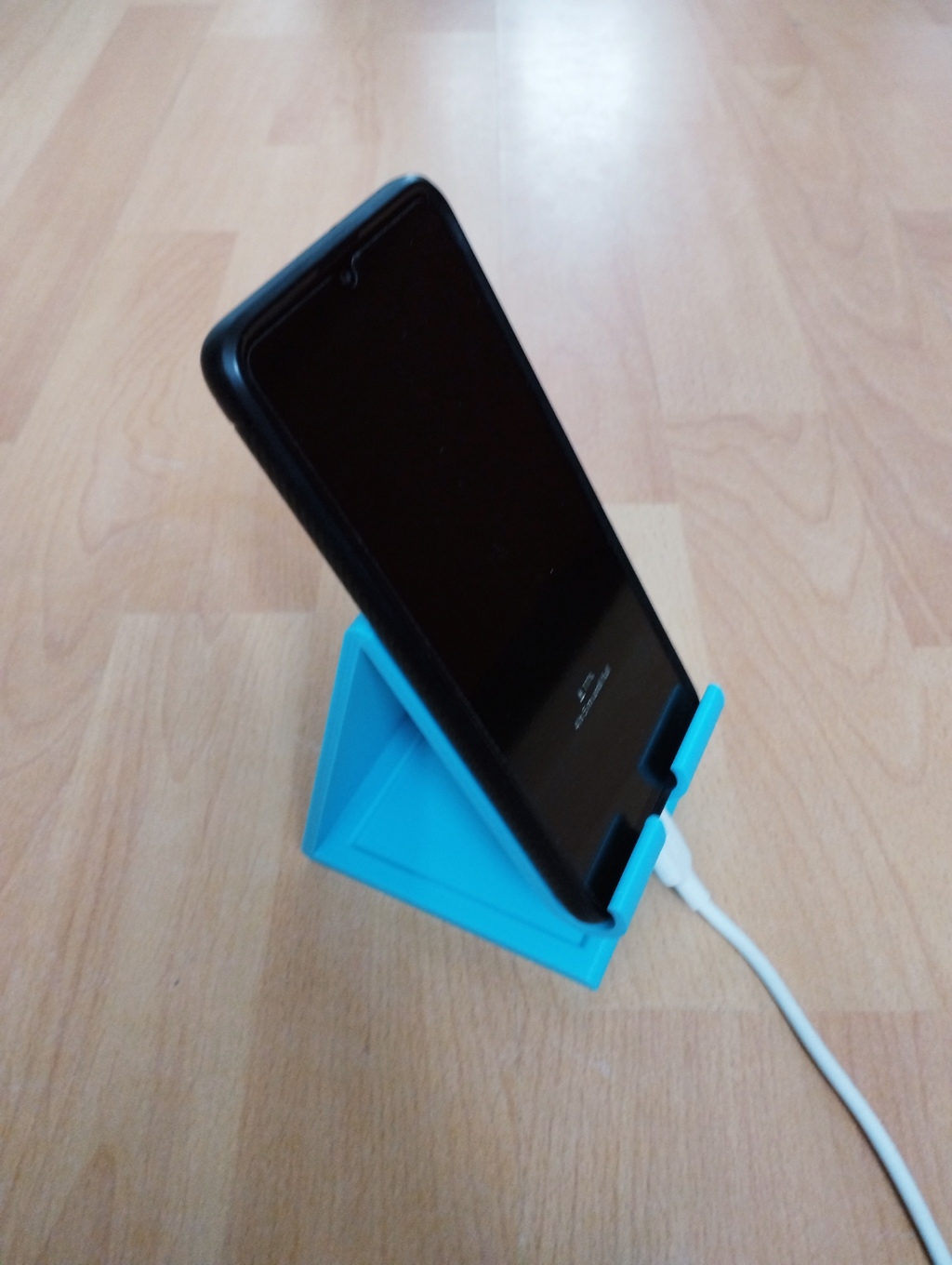phone holder with charging cable hole